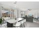 Open-concept living and dining space featuring large windows, contemporary furnishings, and ample natural light at 22964 E Via Del Sol --, Queen Creek, AZ 85142