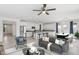 Bright and spacious living room featuring a large kitchen island, neutral tones, and an open-concept design at 22964 E Via Del Sol --, Queen Creek, AZ 85142