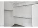 Bright walk-in closet with ample shelving and hanging rods, providing plenty of storage space at 22964 E Via Del Sol --, Queen Creek, AZ 85142