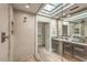 Beautiful bathroom featuring a glass-enclosed shower with tile accents and a spacious vanity at 25555 N Windy Walk Dr # 69, Scottsdale, AZ 85255