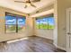 Well-lit bedroom with tile floors and two large windows at 25555 N Windy Walk Dr # 69, Scottsdale, AZ 85255