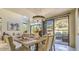 Bright dining room with table, desert landscape views, and open layout to a comfortable living area at 25555 N Windy Walk Dr # 69, Scottsdale, AZ 85255