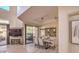This dining room is featuring stone floors, modern light fixtures, and sliding glass doors to the patio at 25555 N Windy Walk Dr # 69, Scottsdale, AZ 85255