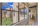 Hallway featuring large windows, offering nice views of outdoor flora at 25555 N Windy Walk Dr # 69, Scottsdale, AZ 85255