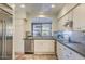 Spacious kitchen with stainless steel appliances, ample counter space, and a scenic backyard view at 25555 N Windy Walk Dr # 69, Scottsdale, AZ 85255