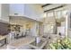 Open-concept living room featuring high ceilings, a fireplace, and a dining area at 25555 N Windy Walk Dr # 69, Scottsdale, AZ 85255