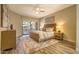 Serene main bedroom with a large window offering scenic views and natural light at 25555 N Windy Walk Dr # 69, Scottsdale, AZ 85255