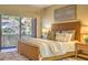 Bright and cozy main bedroom with a decorative headboard and scenic outdoor views at 25555 N Windy Walk Dr # 69, Scottsdale, AZ 85255