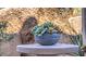 Succulent arrangement decorates a stylish outdoor patio with unique mountain views at 25555 N Windy Walk Dr # 69, Scottsdale, AZ 85255