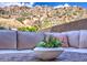 Close-up of outdoor furniture with a picturesque mountain view, creating a tranquil outdoor space at 25555 N Windy Walk Dr # 69, Scottsdale, AZ 85255