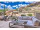 Relaxing outdoor patio with comfortable seating and desert mountain views at 25555 N Windy Walk Dr # 69, Scottsdale, AZ 85255