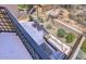 Comfortable outdoor patio space with stone flooring, seating, and landscaped desert surroundings at 25555 N Windy Walk Dr # 69, Scottsdale, AZ 85255