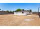 Large backyard with dirt ground and block wall at 2721 W Luke Ave, Phoenix, AZ 85017