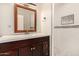 Bathroom featuring vanity with drawers, tiled shower, stylish mirror and modern fixtures at 2721 W Luke Ave, Phoenix, AZ 85017