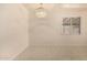 A spacious dining room with bright lighting and tile floors at 2721 W Luke Ave, Phoenix, AZ 85017