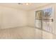 Room featuring tile floors and a sliding glass door leading to the outdoors at 2721 W Luke Ave, Phoenix, AZ 85017