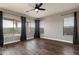 Bright bedroom featuring wood floors, neutral walls, and view of the pool at 2761 W Via Calabria --, Phoenix, AZ 85086