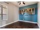 Charming bedroom featuring hardwood floors, a ceiling fan, and stylish wood cabinets at 2761 W Via Calabria --, Phoenix, AZ 85086