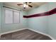 Bedroom with blue painted wall and carpeted floor at 2761 W Via Calabria --, Phoenix, AZ 85086