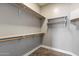 Walk-in closet featuring ample shelving and carpeted floor at 2761 W Via Calabria --, Phoenix, AZ 85086