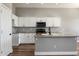 Bright kitchen with white cabinets, granite countertops, stainless steel appliances, and an island at 2761 W Via Calabria --, Phoenix, AZ 85086