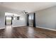Spacious living room with wood floors, neutral walls, large windows, and modern ceiling fans at 2761 W Via Calabria --, Phoenix, AZ 85086