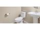 Powder room features a pedestal sink and toilet at 29356 N 67Th Ave, Peoria, AZ 85383