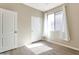 Bedroom with two closets, neutral paint, and a window with sheer curtains at 29356 N 67Th Ave, Peoria, AZ 85383