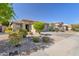 Charming single-story home with desert landscaping, stone accents, and a well-maintained front yard in a quiet neighborhood at 29356 N 67Th Ave, Peoria, AZ 85383