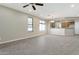 Open living room with tile floors, neutral walls, and views into the kitchen creating an inviting and spacious living area at 29356 N 67Th Ave, Peoria, AZ 85383