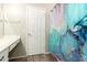 Bathroom featuring a vanity and shower with colorful shower curtain at 3049 W Santa Cruz Ave, San Tan Valley, AZ 85144