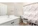 Clean bathroom featuring a single sink vanity, toilet, and shower with curtain at 3049 W Santa Cruz Ave, San Tan Valley, AZ 85144