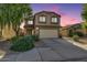 Charming two-story home with a two car garage, desert landscaping, and a cozy front porch at 3049 W Santa Cruz Ave, San Tan Valley, AZ 85144