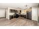 Spacious kitchen featuring stainless steel appliances, dark cabinets and tiled floors at 3049 W Santa Cruz Ave, San Tan Valley, AZ 85144