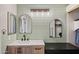 Stylish bathroom featuring modern vanity, decorative mirrors, and updated fixtures at 3440 E Southern Ave # 1042, Mesa, AZ 85204