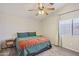 Cozy bedroom featuring soft carpet, neutral walls, and a ceiling fan at 3440 E Southern Ave # 1042, Mesa, AZ 85204
