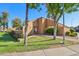 Attractive building exterior with a well-maintained lawn, mature trees, and colorful flower beds at 3440 E Southern Ave # 1042, Mesa, AZ 85204