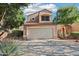 Charming two-story home featuring a two-car garage, tile roof, and desert landscaping at 3440 E Southern Ave # 1042, Mesa, AZ 85204