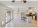 Open-concept kitchen with stainless steel appliances and breakfast bar, adjacent to dining area at 3440 E Southern Ave # 1042, Mesa, AZ 85204