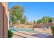 Community swimming pool area with lounge chairs and mature trees, providing a relaxing outdoor space at 3440 E Southern Ave # 1042, Mesa, AZ 85204