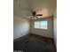 Bedroom with a ceiling fan, neutral paint and street view at 3441 W Windrose Dr, Phoenix, AZ 85029