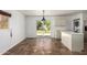 Bright dining room with tile flooring and a sliding glass door leading to the outside at 3644 W Maryland Ave, Phoenix, AZ 85019