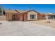 Inviting single-story brick home with desert landscaping and long drive way at 3644 W Maryland Ave, Phoenix, AZ 85019