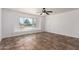 Bright living room with a ceiling fan, tile flooring and lots of natural light at 3644 W Maryland Ave, Phoenix, AZ 85019