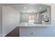 Modern kitchen featuring a stylish breakfast bar, stainless steel appliances, and sleek white cabinetry at 37053 W Amalfi Ave, Maricopa, AZ 85138