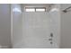 Modern shower-tub with tiled walls and updated fixtures in bathroom at 37053 W Amalfi Ave, Maricopa, AZ 85138