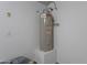 Water heater installation inside of garage with a short platform at 37053 W Amalfi Ave, Maricopa, AZ 85138