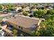 The aerial view showcases a well-maintained neighborhood with mature trees and tile roof homes at 4032 S Santa Rita Pl, Chandler, AZ 85249