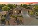 Stunning aerial view of a well-maintained property with desert landscaping and a tile roof at sunset at 4032 S Santa Rita Pl, Chandler, AZ 85249