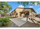 The back of the home features a covered patio, well-kept lawn, and low maintenance landscaping at 4032 S Santa Rita Pl, Chandler, AZ 85249